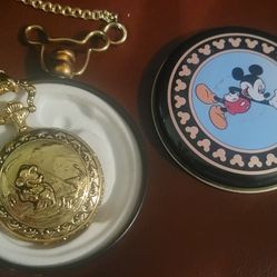 Vintage Disney Mickey Mouse Verichron Quartz Pocket Watch. 
It features a classic Mickey Mouse illustration on the dial. 
The watch has a gold-tone ca