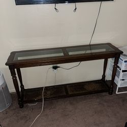 Wooden console table with glass top