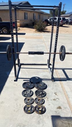 Fitness cage with Olympic bar and weights