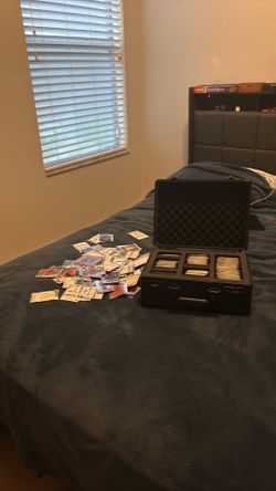 More than 500 sports cards and like five autographs and comes with the briefcase plus shipping