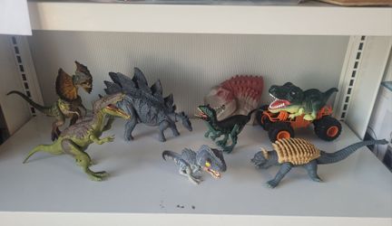 6 Dinosaur figures and 1 hand puppet