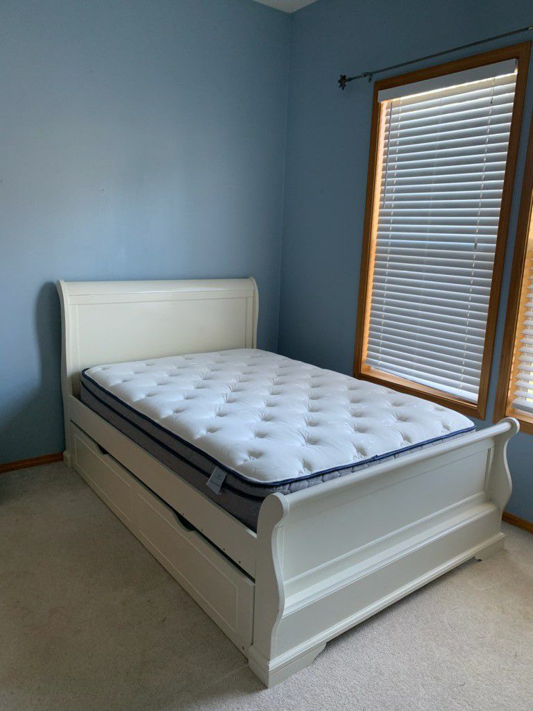 Full size bed with twin trundle. Mattresses included.