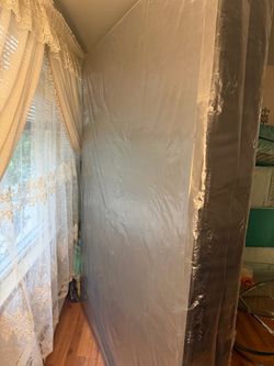 Box spring bed  in Plastic Wrap