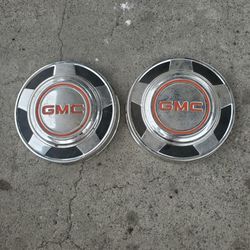 Two GMC Truck Hubcaps