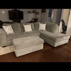 Great three-piece sectional And ottoman With Two Glass End Table Included