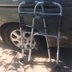 Like new fold up adjustable walker on wheels only $25 firm