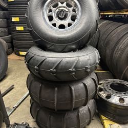 15” KMC Impact 4/137 for canam with 33” Sand Slingers 