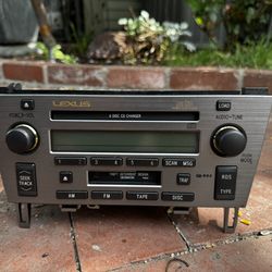 Genuine OEM radio receiver and 6-disc CD changer assembly.