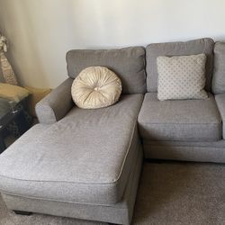 Sectional With Pillows And Coffee Table