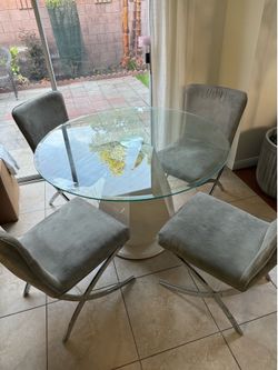 Dining table with glass top and 4 chairs