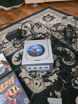 GameCube console with cords and games and a ton of accessories