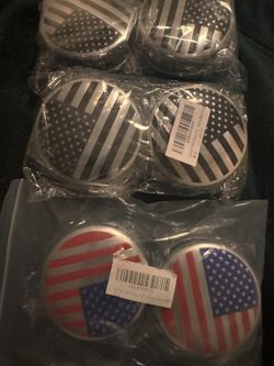 Two sets of American style center hubcaps 