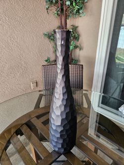Tall, dark, textured ceramic vase