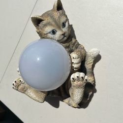Decorative resin garden statue featuring a tabby Kitty 
