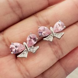 Pink bow stud earrings. Silver Plated. New
