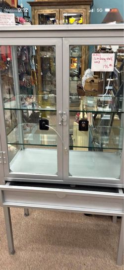 Unique glass cabinet with shelves in drawers