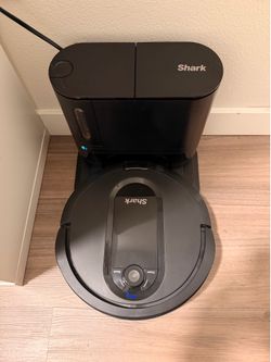 Shark robot vacuum with self emptying base