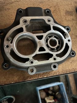 Harley transmission trap door