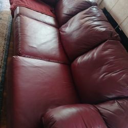 Two Piece Burgundy Leather Couch Set Has 4 Small Rips