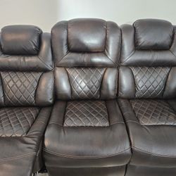 Signature Design by Ashley® Warnerton Chocolate Power Reclining Sofa with Adjustable Headrest