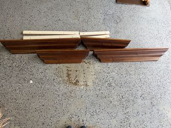4 wood stained shelves with support beams