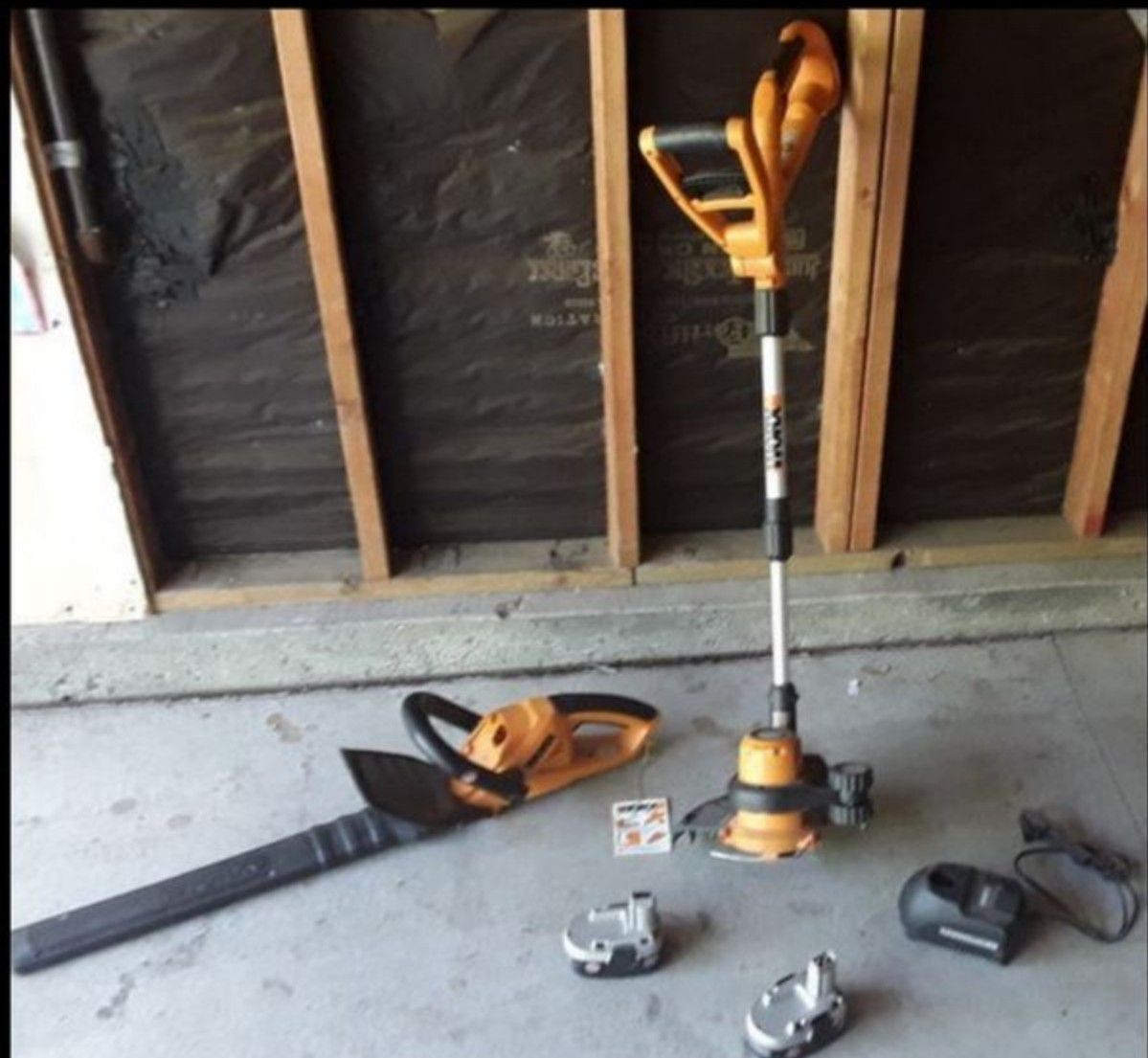 Weed eater and edger with 2 batteries and charger with bracket holding stand combo