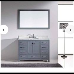 Caroline Avenue 45.7 in. W x 31.5 in. H Framed Mirror in Gray Finish.