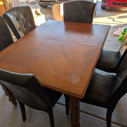 54" × 42" Wooden Dining Table and 6 Chairs. $15 Delivery.