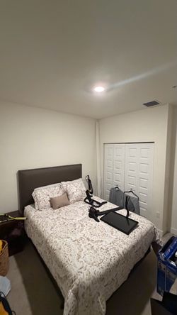 Queen bed with upholstered headboard