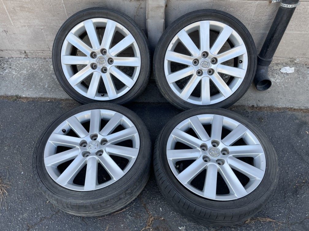 Mazda 3 aluminum 18 inch rims with old tires. 5 on 114.3 lugs