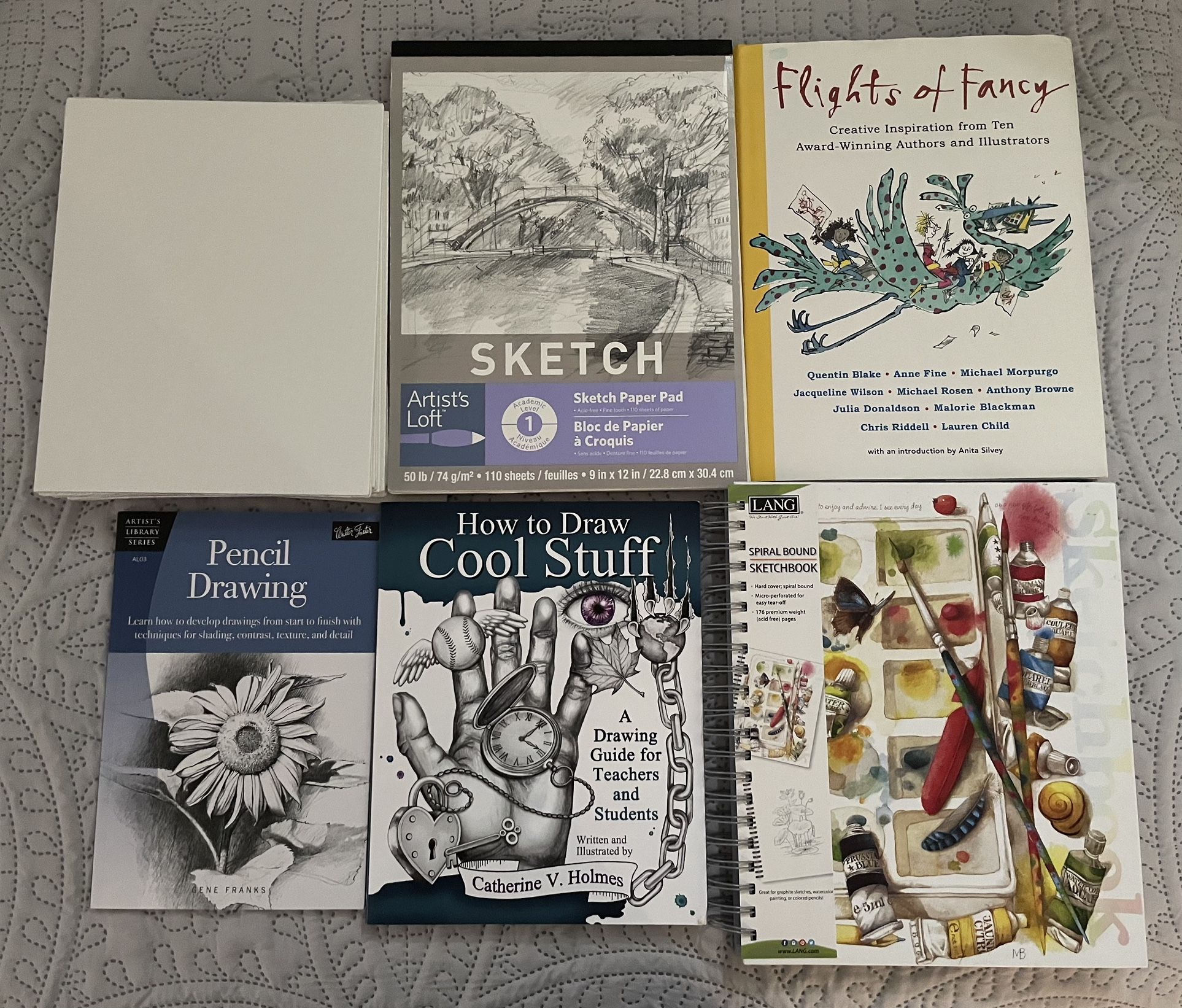 Collection of art supplies and guides