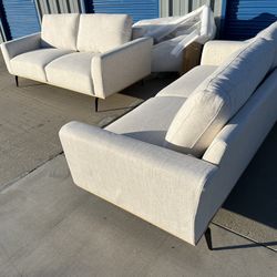 Brand new. Set of 2. 83” Mid Century Modern Sofas. Cream color fabric. Set Retails over $3000