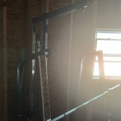 bench rack with a pulldown machine 