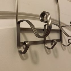 Hanging Over-Door: 3 Double-Hooks Hanger. Nice design. New. Never used. Great bargain. 8.5” wide.