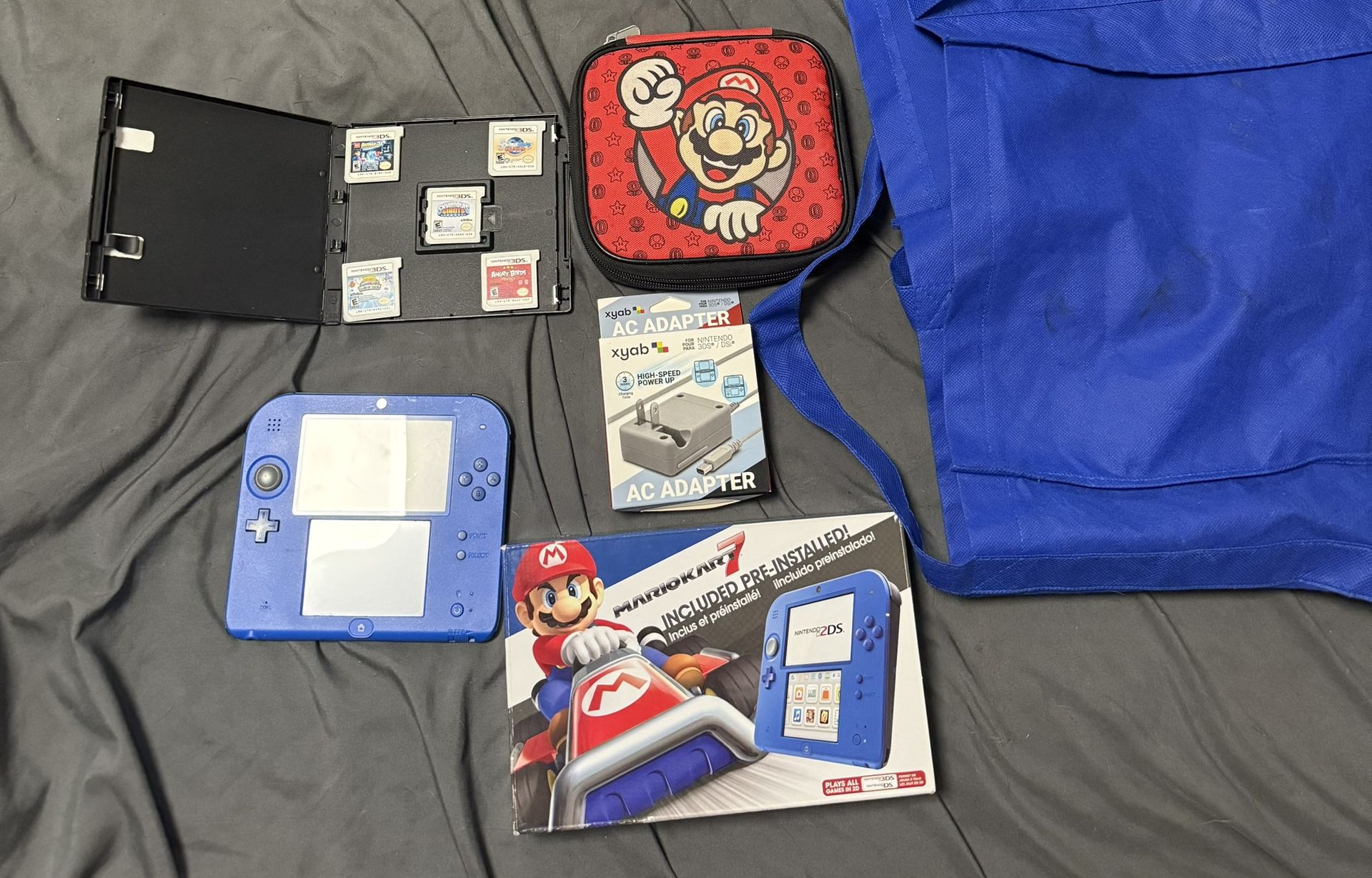 Nintendo 2DS, 2DS Charger, 3ds Box With 6 3DS Games and one Ds game