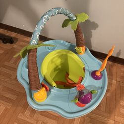 Bright Starts Disney Baby SuperSeat, a fun baby seat for sitting, playing, and mealtimes, for ages 4 months to 4 years, blue and green.