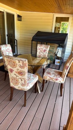 Pier one glass top table and 4 chairs