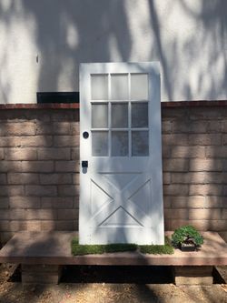 Solid Wood Exterior Door with Glass Panels – $150 Solid wood exterior door with glass panels and a decorative cross-panel design. Great for a home, g