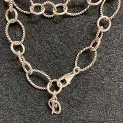  The Carolyn Pollack Silver Cable Link Charm Bracelet is a vintage piece of jewelry made of 925 sterling silver. It features a charm style design with