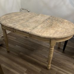 Wooden table with expansion wing