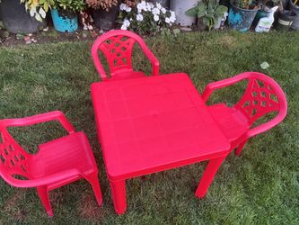Red plastic table and 3 chairs set