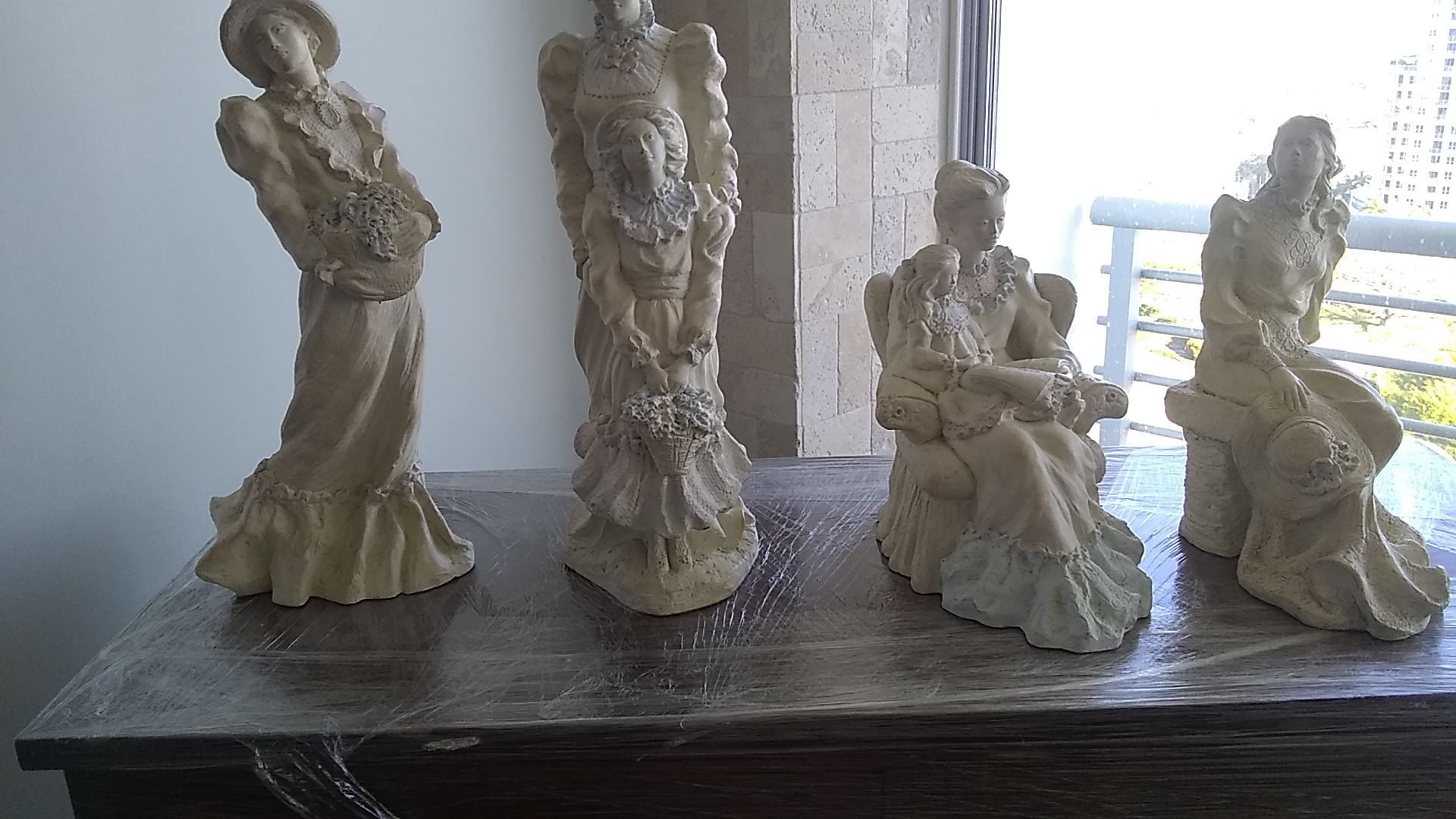 4 different Alice Heath Collection of statues