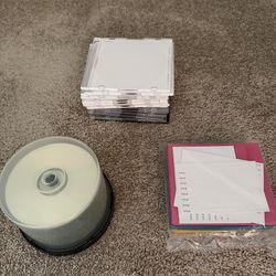 Various blank CDs and DVDs with sleeves