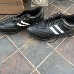 Black lace up sneakers.