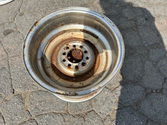 This is a single classic 15x10 inch baby moon style chrome steel rim. The rim has two lug patterns, and will fit on most classic 5 lug cars. It should