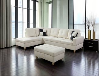 White leather sectional couch and ottoman