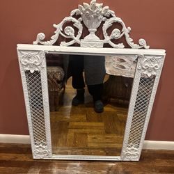 Ornate white painted antique French Louis XVI-style mirror 