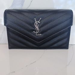 Black and silver YSL cross body bag