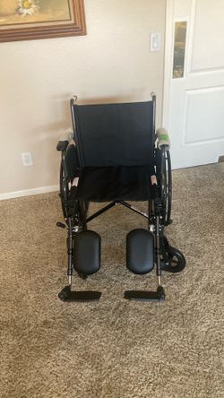 Wheelchair New with 18”seat and footrests