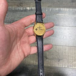 Boeing gold rotating airplane watch with a black leather strap